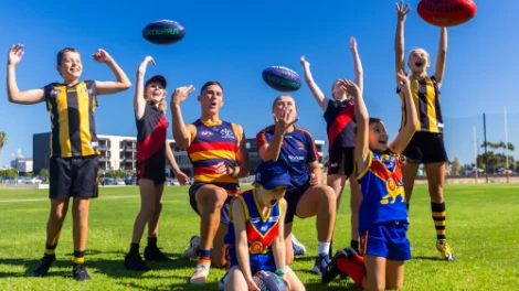 AFL player Isaac Cumming and AFLW player Chelsea Biddell, celebrating with young footy fans from Mundulla, Wirrulla and Booleroo-Melrose-Wilmington Football clubs AFL player Isaac Cumming and AFLW player Chelsea Bidell, celebrating with young footy fans from Mundulla, Wirrulla and Booleroo-Melrose-Wilmington Football clubs.jpg