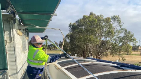 Viterra employee, Emily Fretwell probing the first 2024/25 harvest delivery to Wolseley, a load of canola First 2024.25 delivery to Wolseley_web.jpg