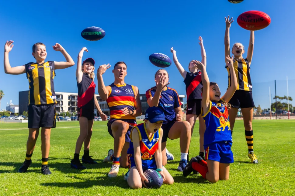 AFL player Isaac Cumming and AFLW player Chelsea Bidell, celebrating with young footy fans from Mundulla, Wirrulla and Booleroo-Melrose-Wilmington Football clubs.jpg