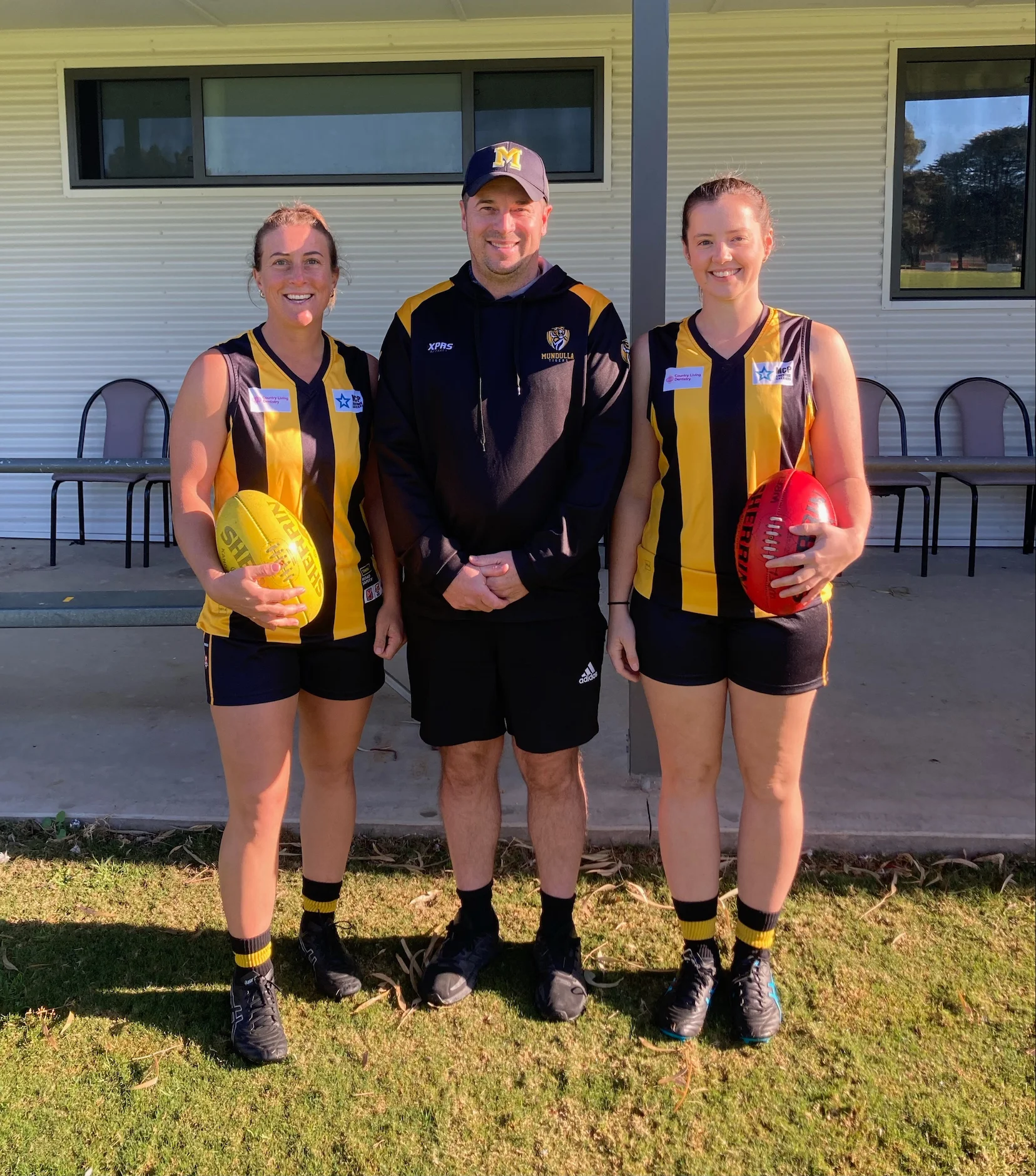 Mundulla FC's players Kim Parker (L) and Kelly Dunn (R) with club president Nick Davis (C) Mundulla FC's players Kim Parker (L) and Kelly Dunn (R) with club president Nick Davis (C).jpeg