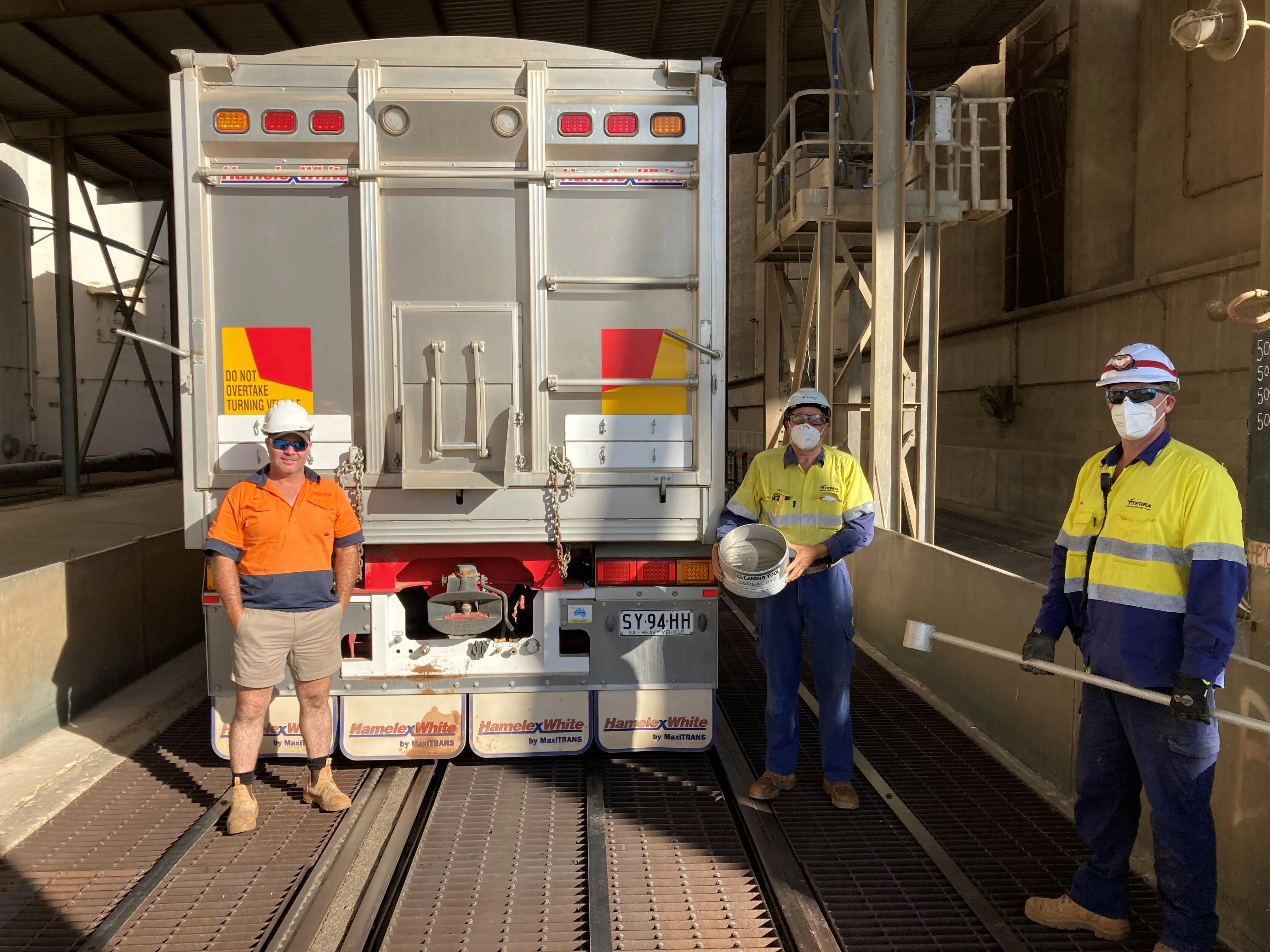 Ben Bussenschutt delivering the first load into Port Pirie with Viterra employees Tim Sherwood and David Bateman. 18102021 report.jpg